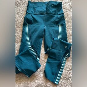 lululemon teal performance leggings with striped side accents